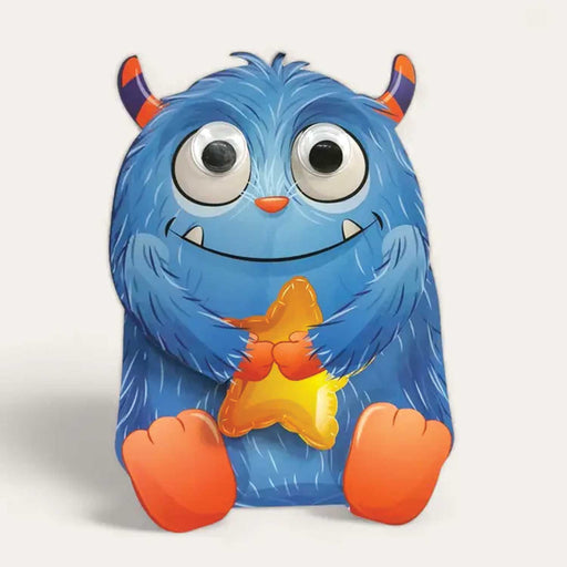 blue smiling monster cut out card with orange and purple horns, orange feet and hands and holding a star shaped balloon
