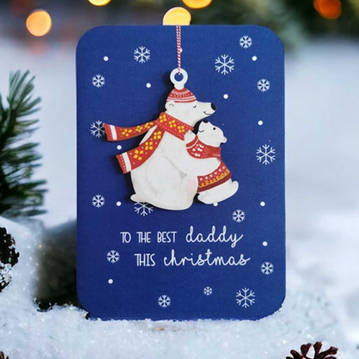 blue christmas greeting card with wooden ornament of a biig and little polar bear hugging