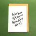 white card on top of brown envelope in front of green background. Text on card says "Woohoo it's your wedding day!"
