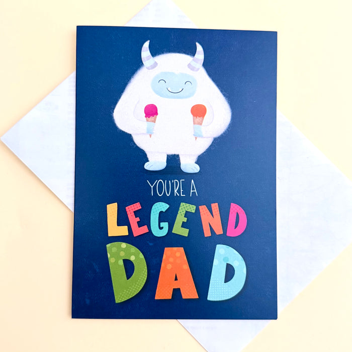 Youre a Legend Dad blue greeting card with multicolour lettering and smiling friendly fluffy white monsters with horns holding two ice cream cones