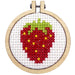 Cross-stitched strawberry design in a wooden hoop on a white background