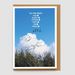 Greeting card with cloud and hand-drawn lines against a blue sky, on top of brown envelope with a white background.