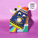 Colourful birthday card with a rocket with jiggly eyes on a pink background