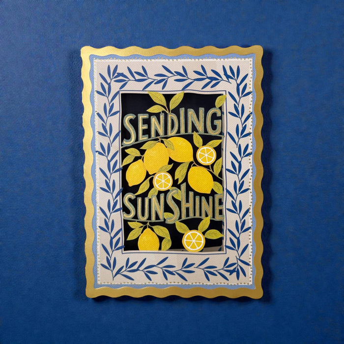 Decorative card with lemons and 'Sending Sunshine' text on a blue background