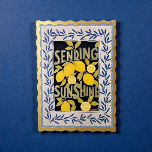 Decorative card with lemons and 'Sending Sunshine' text on a blue background