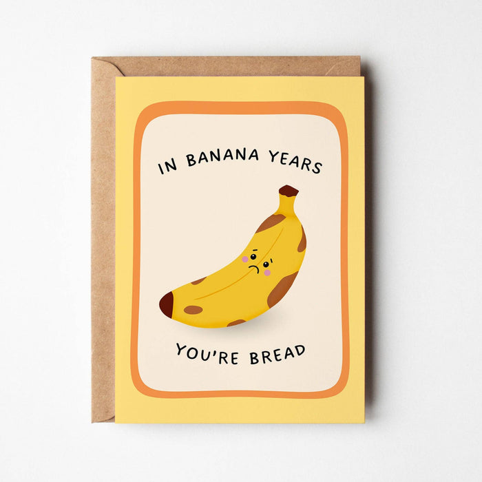 Greeting card with a banana illustration and text on a white background