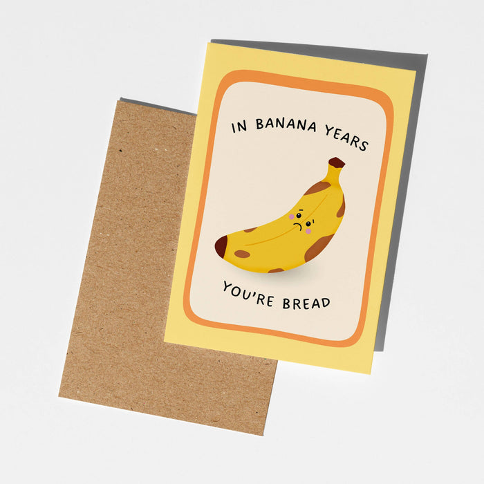 Card with a banana illustration and text 'In banana years you're bread' on a white background