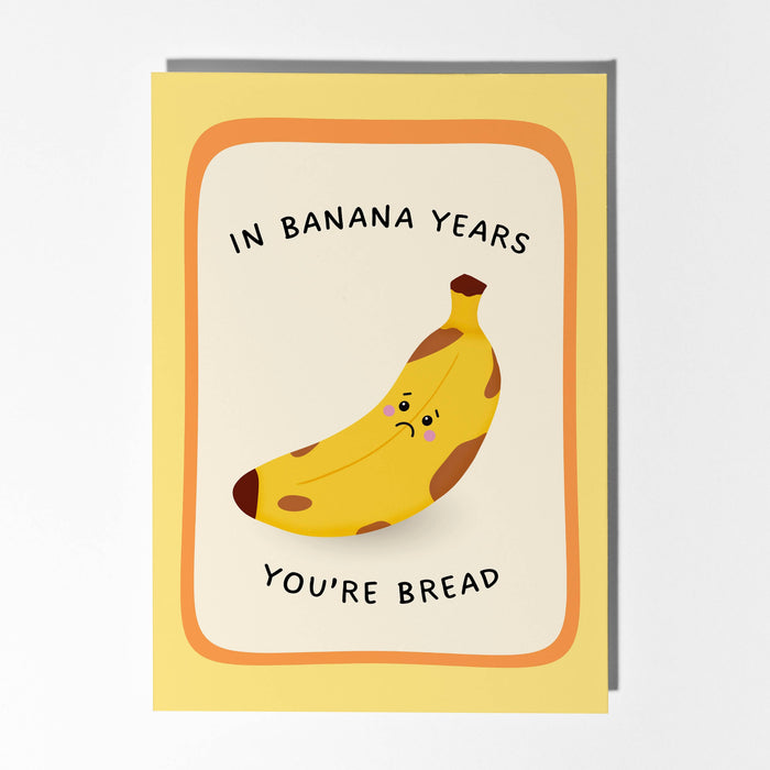 Greeting card with a banana illustration and text on a white background
