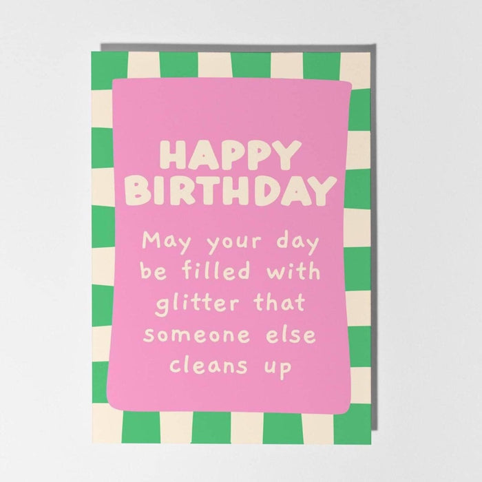 Birthday card with pink text on a green and beige checkered border