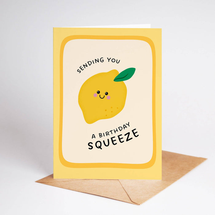 Greeting card with a lemon illustration and text 'Sending you a birthday squeeze' on a white background.