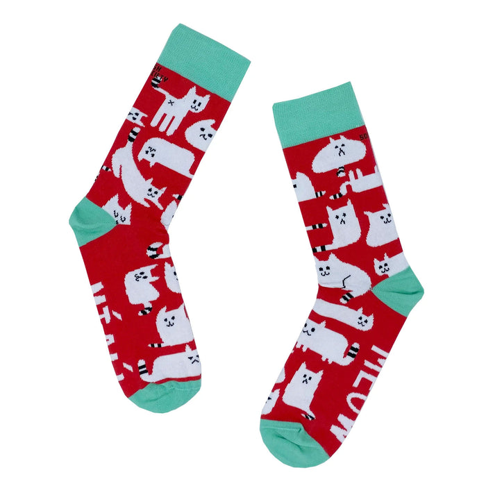 pair of red socks with blue trim and pattern of white cats white black stripes on tails