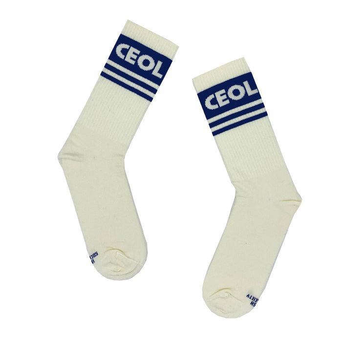 pair of white socks with 3 blue bands on each socks and ceol in white lettering in the thickest blue band