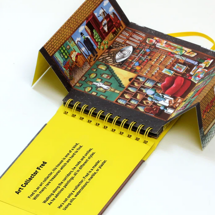 A spiral-bound pop-up book titled 'Art Collector Fred' shown open on a white background, displaying a detailed illustrated interior scene on the cover and descriptive text on a bright yellow page.
