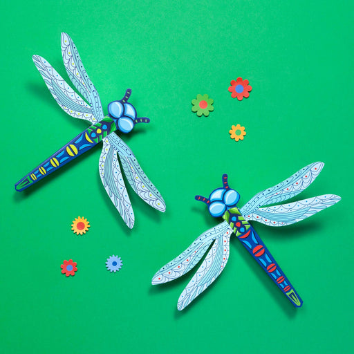 Colorful dragonfly-shaped objects on a green background