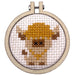 cross stitch embroidery hoop featuring cow design