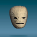 A small carved stone or clay mask with a smooth, rounded shape, featuring simple black eye and mouth details, floating against a gradient blue background.