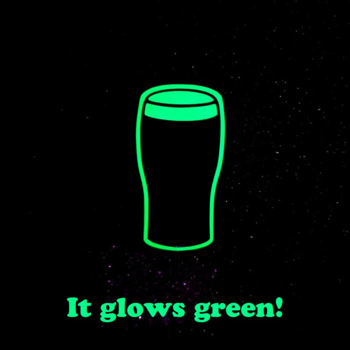 A black background with a neon green outline drawing of a pint glass and the text 'It glows green!' in matching green at the bottom.