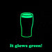 A black background with a neon green outline drawing of a pint glass and the text 'It glows green!' in matching green at the bottom.