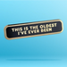 A rectangular enamel pin with rounded corners, featuring a black face and gold-toned border. The text 'THIS IS THE OLDEST I'VE EVER BEEN' is raised in gold lettering.