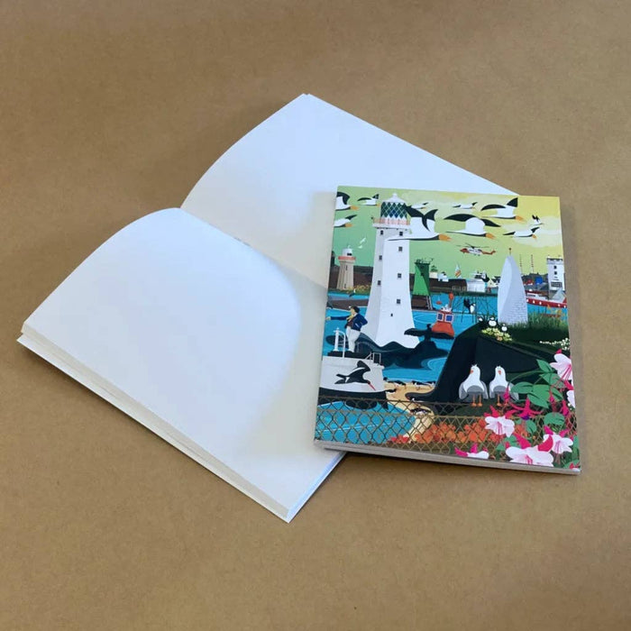 Notebook with a lighthouse design on a brown background