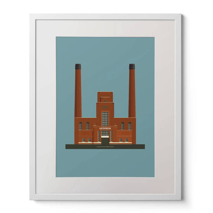Framed artwork of a brown building with two tall chimneys on a blue background