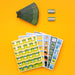A flat-lay product shot of a children's art and sticker kit on a solid orange background. The kit includes a fanned-out sheet of dark green paint swatches, two small metal sticker strips reading 'Sticker Star', and three colorful sticker sheets featuring cartoon animals and scenes.
