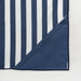 Corner of navy and white striped towel on a light gray background