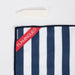 Navy and white striped towel with a red 'Flaminguelo' label on a white background