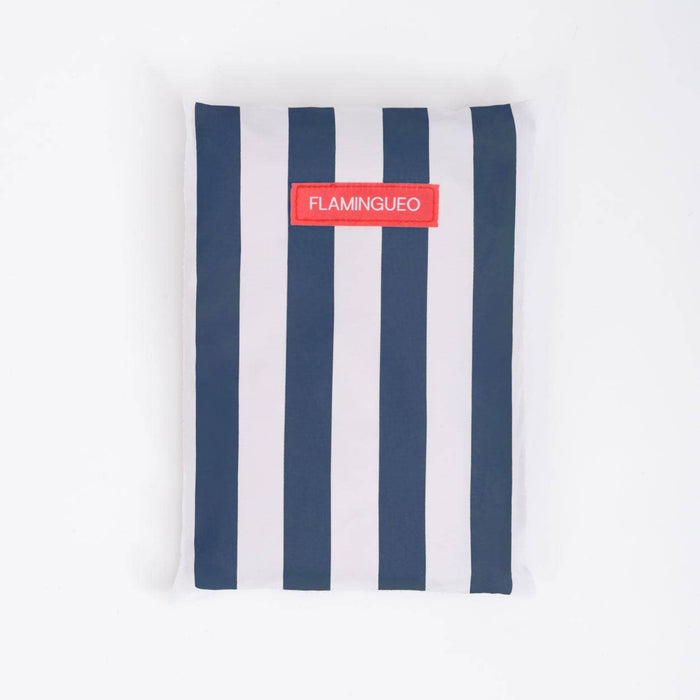Navy and white striped towel with 'Flamingueto' label on a white background