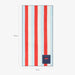 Striped towel with red and white stripes on a light blue background, featuring a small navy pocket.