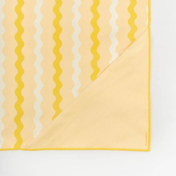 Yellow and white striped towel on a white background