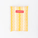 Yellow and white striped carrying pouch with a red 'FLAMINGUERO' label on a white background