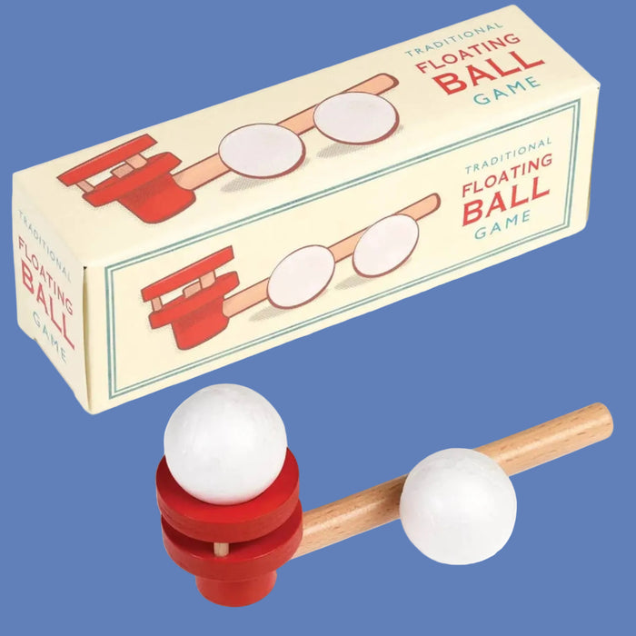 Traditional Floating Ball Game with packaging on a bluebackground