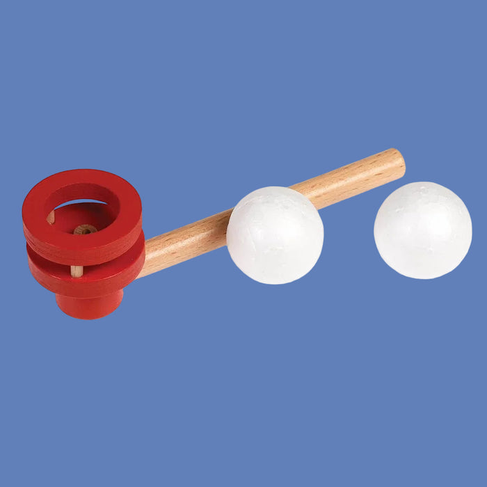 Red and wooden toy with white balls on a blue background