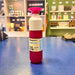 Fuchsia and white Dopper reusable water bottle with fuchsia cap on a blue surface.