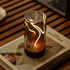 Decorative lamp with a warm glow on a book.