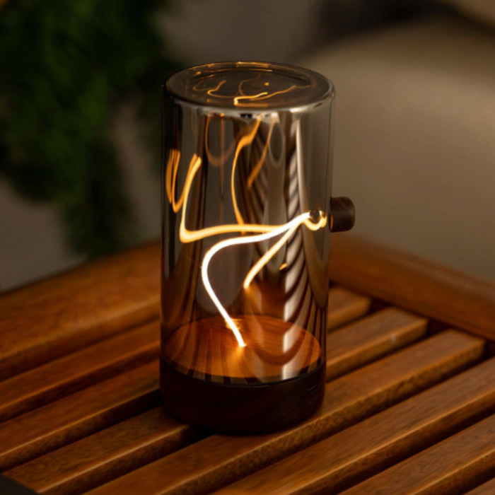 Decorative lamp with a warm glow on a wooden surface