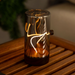 Decorative lamp with a warm glow on a wooden surface