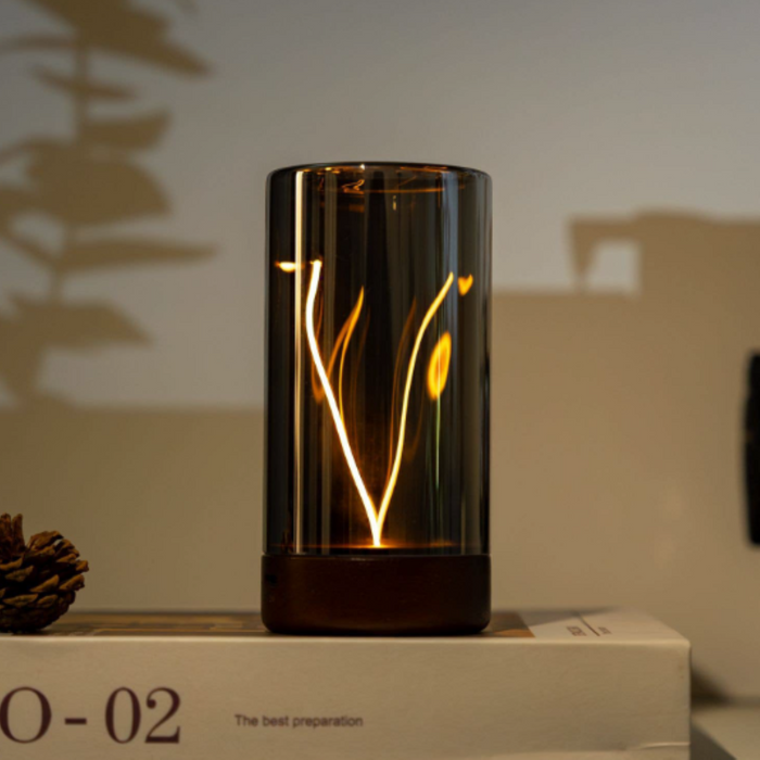 Decorative lamp with white and yellow light on a shelf.