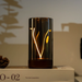 Decorative lamp with white and yellow light on a shelf.