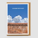 A greeting card with a brown envelope, featuring a blue sky, cartoon gray cats peeking over a red brick wall, and the text 'GO RAIBH MAITH AGAT' in white at the top.