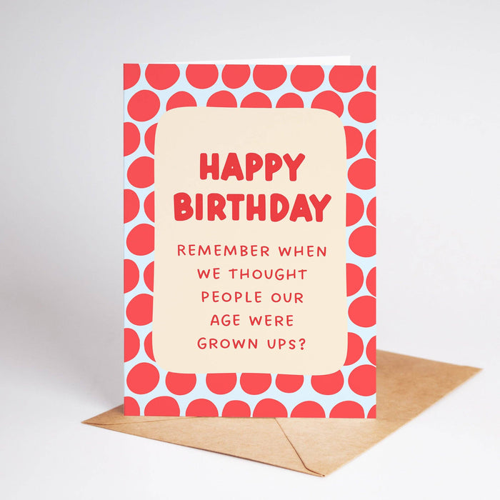 Birthday card with red polka dot border and humorous text on a white background