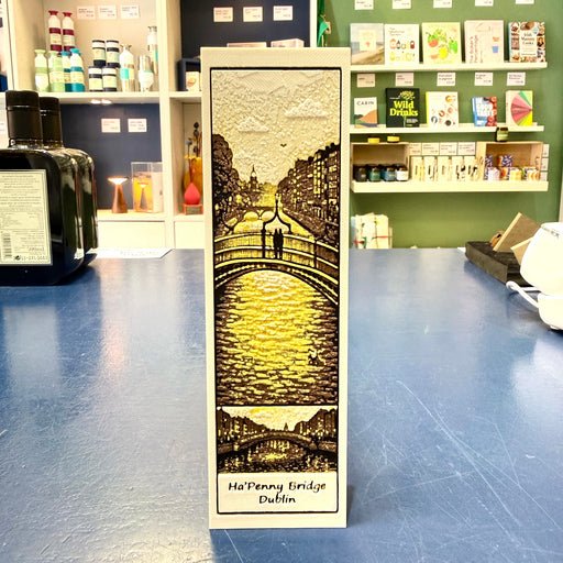 Luminous bookmark with a design of Ha'Penny Bridge in Dublin on a blue surface.