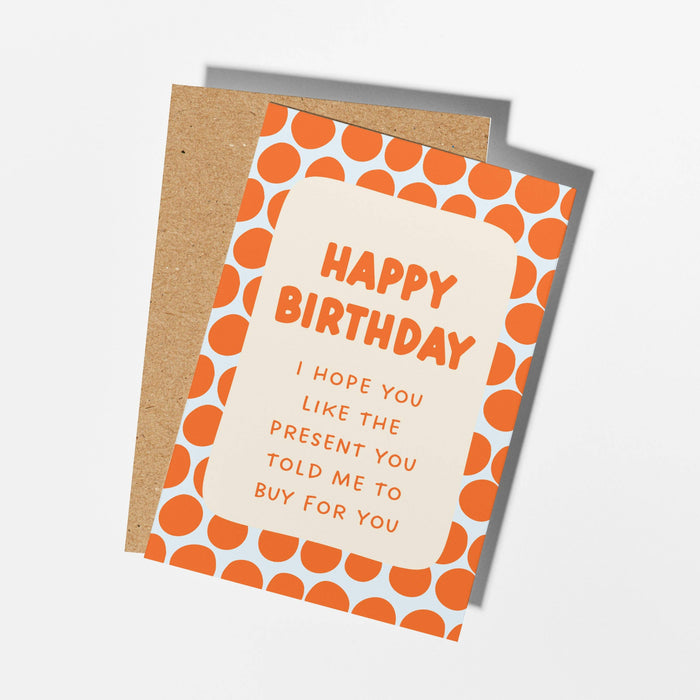 Birthday card with orange polka dots and humorous text on a white background