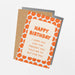 Birthday card with orange polka dots and humorous text on a white background