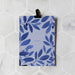 Card with blue leaf pattern and 'I'm so sorry' text on a white marble background