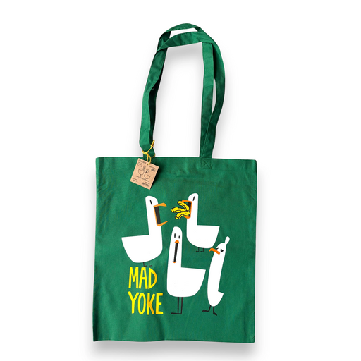 Green tote bag with cartoon seagulls and 'Mad Yoke' text on a white background