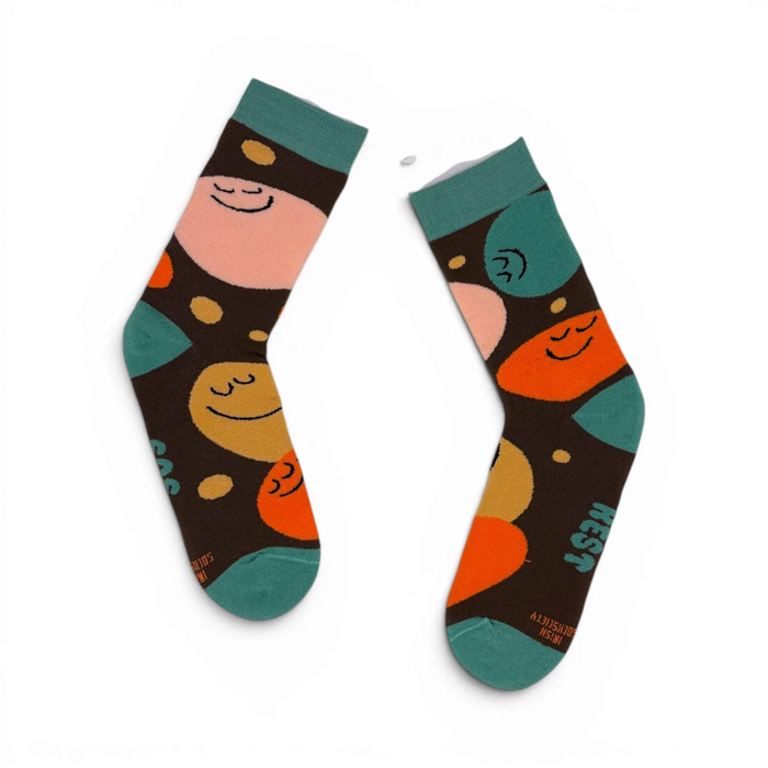 Colorful socks with cartoon character design on a white background