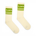 A pair of off-white crew socks with green stripes and the word 'SLÁINTE' printed in white on the ribbed cuffs, displayed against a plain white background.