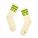 A pair of off-white crew socks with green stripes and the word 'SLÁINTE' printed in white on the ribbed cuffs, displayed against a plain white background.